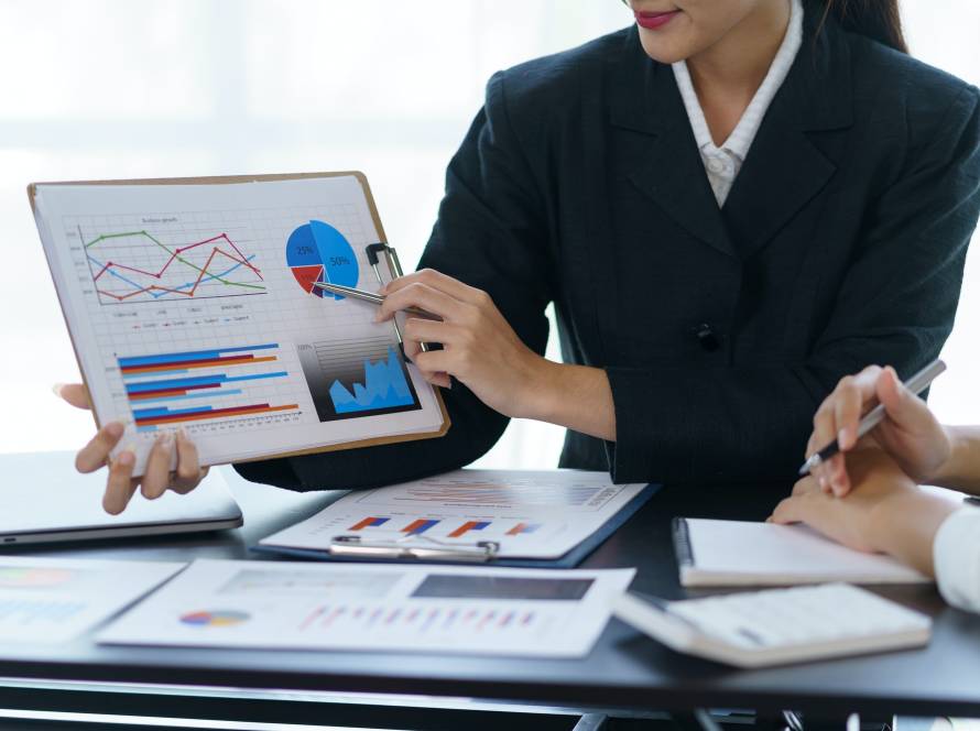 Business people analyzes, graphs and charts to examine and analyze company finances, revenues and bu